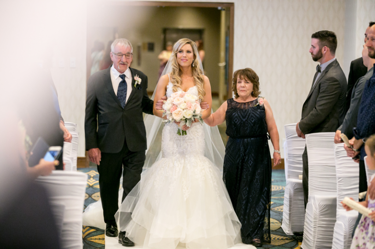 Bride walking down the aisle in Regina by Collin Stumpf Photography