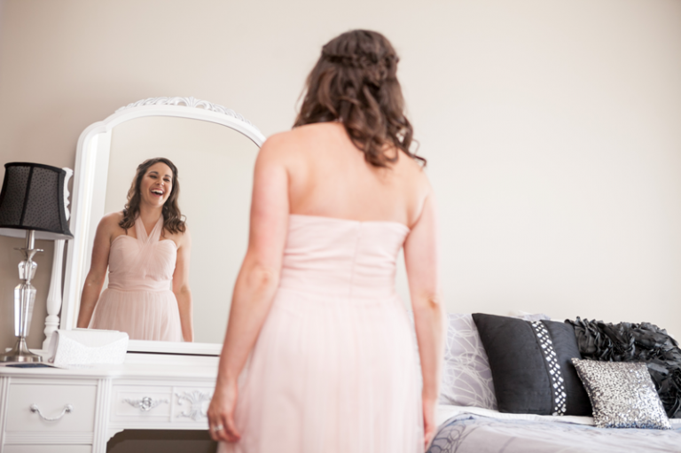 Amanda's bridesmaid looking in the mirror before the ceremony