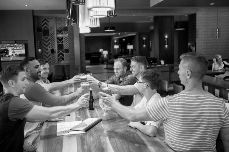 Josh & his groomsmen having drinks before getting dressed for the wedding