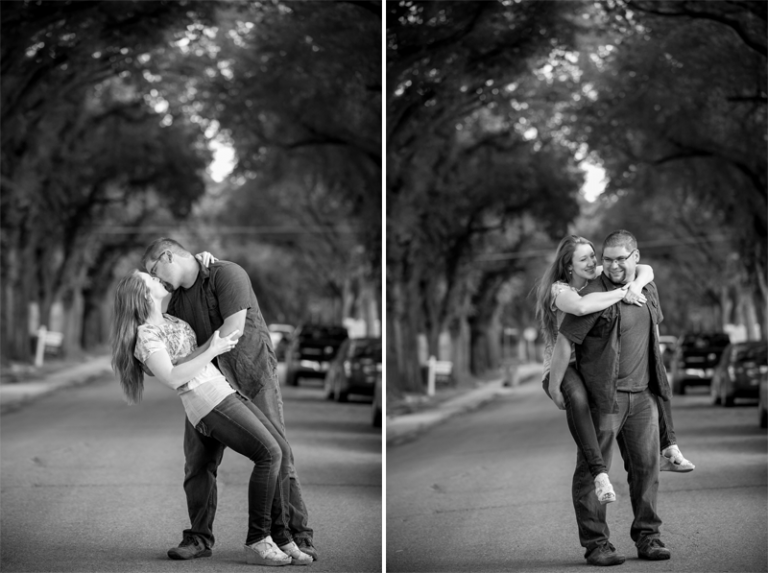 Kiss on tree lined street engagement photographs