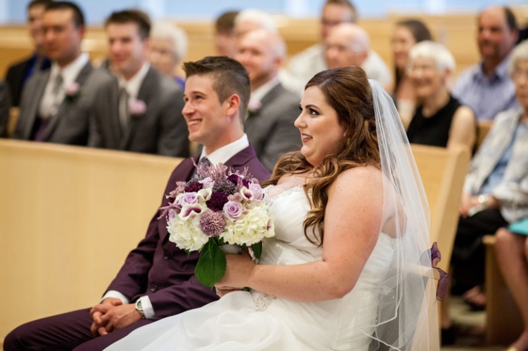 Bride and groom sitting during ceremony