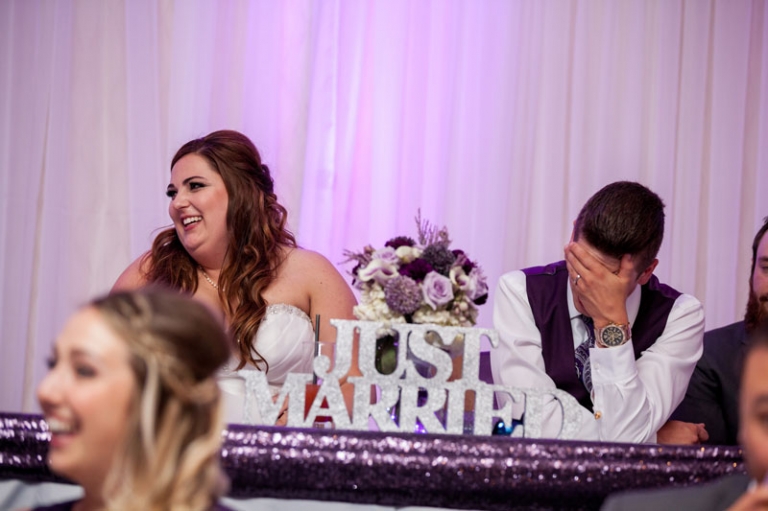 Bride and Groom laughing reception speeches