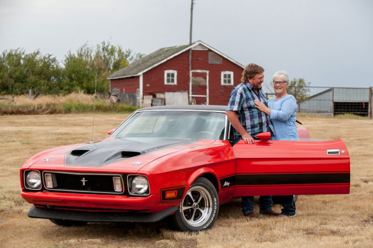 Husband and wife with mustang car