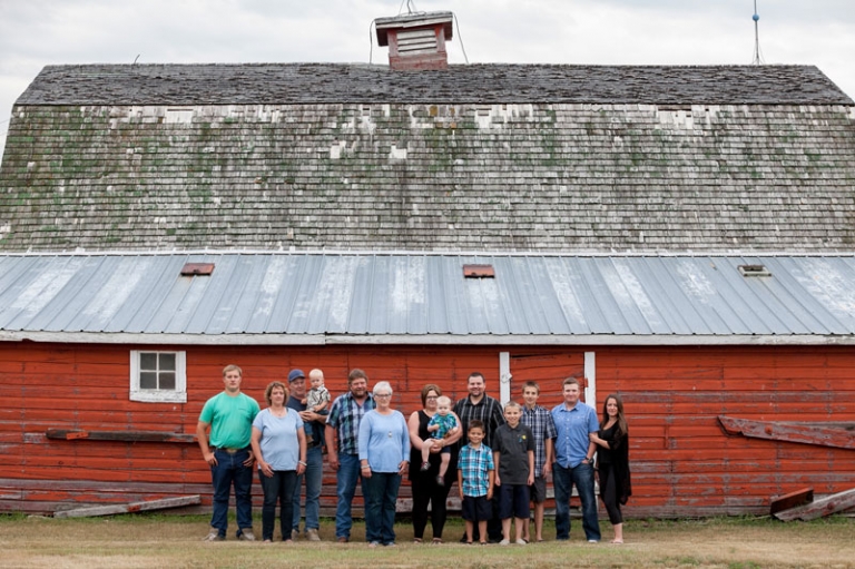 Large Family photograph in front of red barn by Collin Stumpf Photography