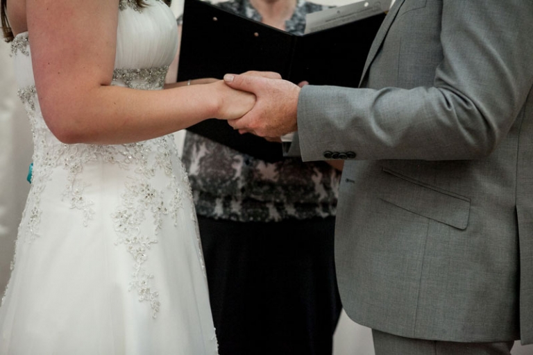 wedding ceremony holding hands detail