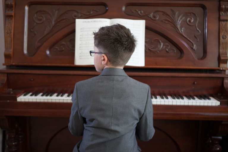 Ring Bearer playing piano