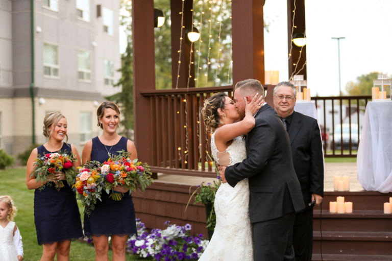 First Kiss during Sunset Ceremony by Collin Stumpf Photography