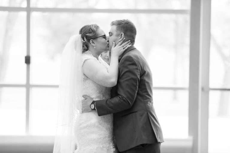 Bride and Groom first kiss at RCMP Heritage Centre Wedding