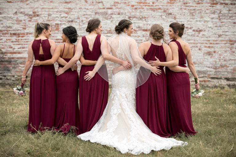 bride and bridesmaid's back of dresses photo